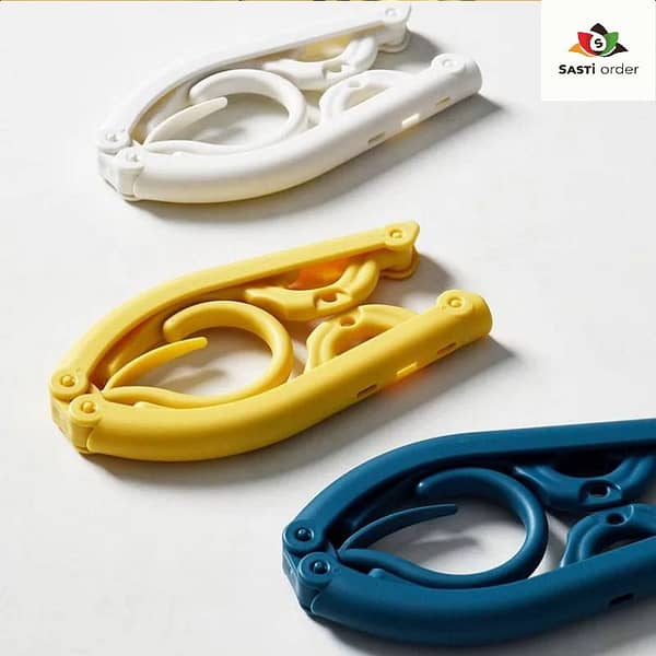 Foldable multicolor plastic hangers designed for travel, offering a compact and portable solution for organizing clothes in small spaces.