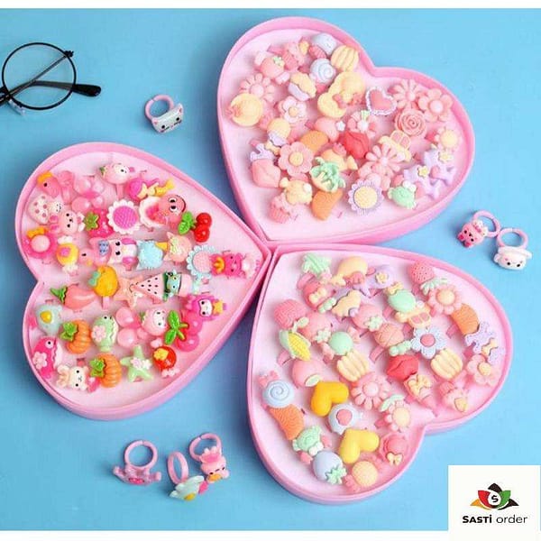 A collection of colorful heart shape kids fancy rings, designed for children, showcasing vibrant hues and playful designs, perfect for dress-up and special occasions.
