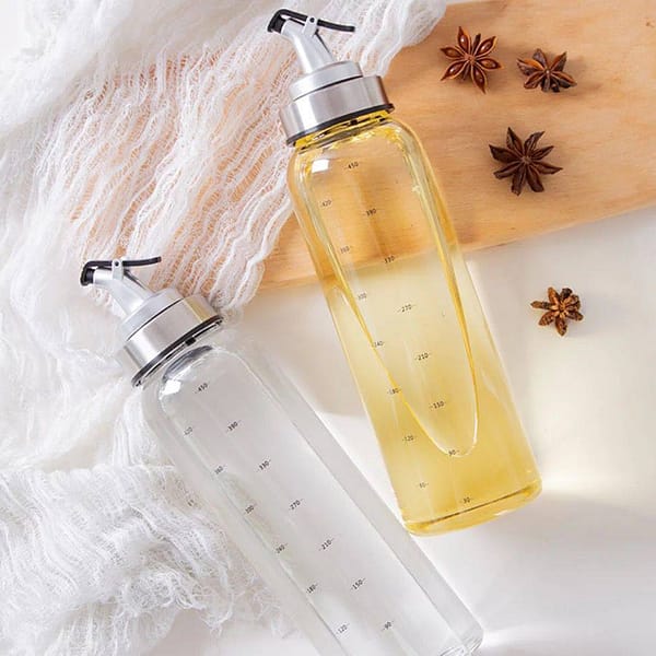A stylish Oil Dispenser made from high-quality glass or stainless steel, designed for controlled pouring of oils. The dispenser features a precision spout to minimize spills, a wide opening for easy refilling, and a sleek design that enhances any kitchen or dining table decor. Ideal for a variety of oils, from olive oil to specialty cooking oils.