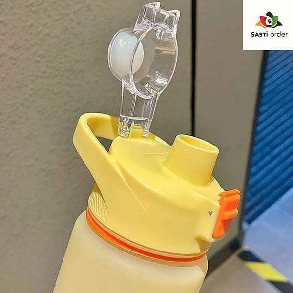 "Large capacity plastic water bottle with a wide mouth design, filled with water and placed on a wooden table, showcasing its lightweight and durable features."