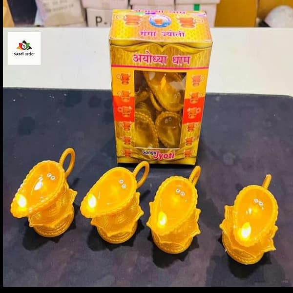 "Panchmukhi Water Sensor Diya glowing in water, showcasing its elegant design and LED lighting."