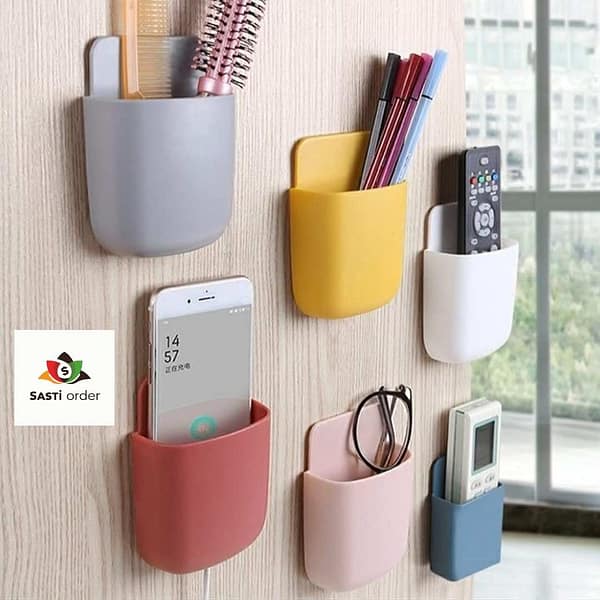 Multipurpose Wall Holder securely mounted on a wall, holding various items like keys, utensils, and toiletries.
